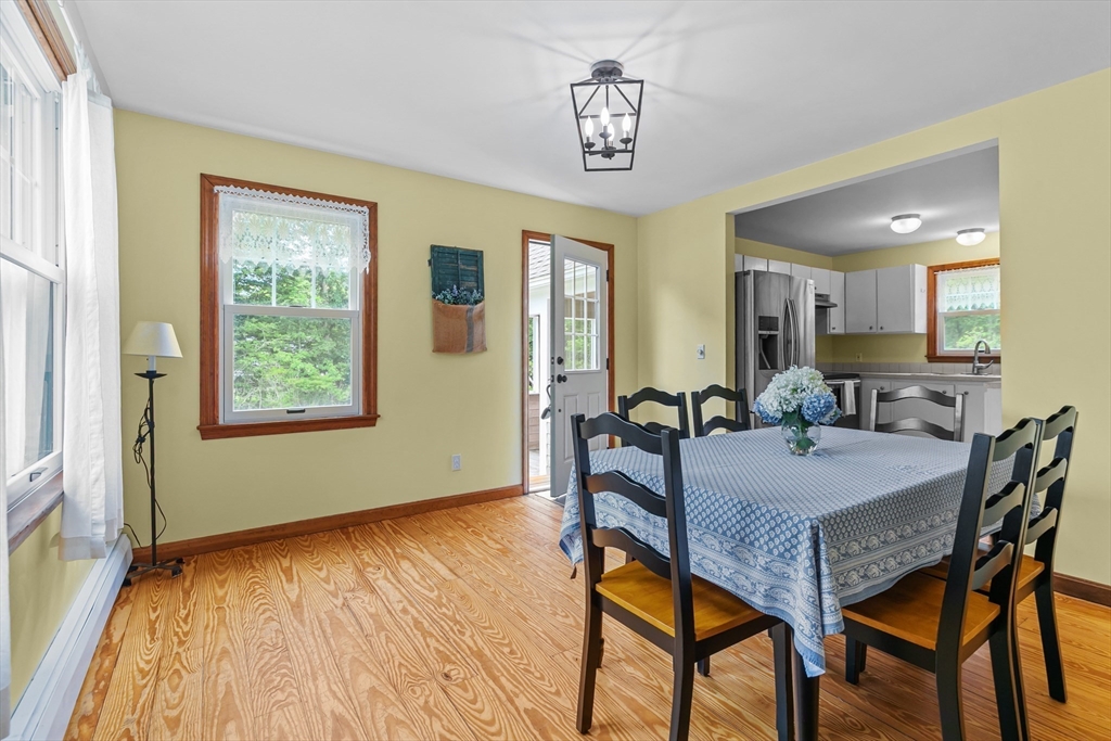 140 I Long Highway Little Compton, RI 02837 - Photo 13 of 41 a view of a dining room with furniture and a window
