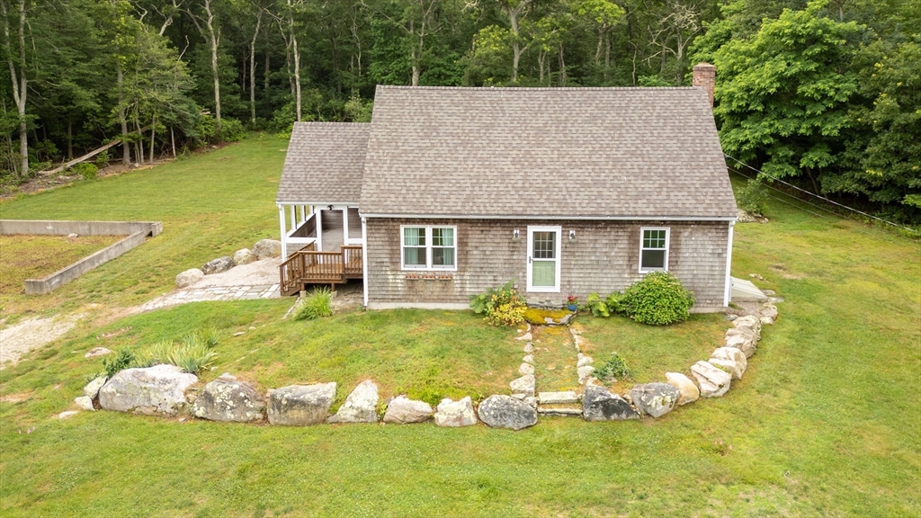 140 I Long Highway Little Compton, RI 02837 - Photo 2 of 41 a view of a house with a yard porch and sitting area