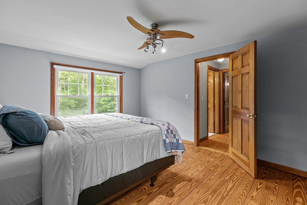 140 I Long Highway Little Compton, RI 02837 - Photo 21 of 41 a bedroom with a bed and a large window