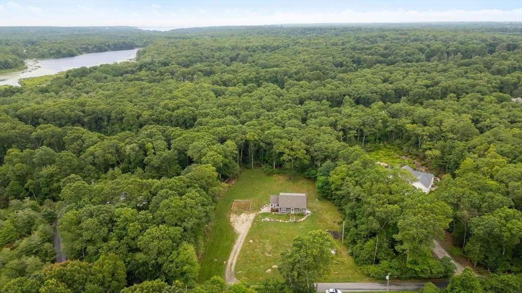 140 I Long Highway Little Compton, RI 02837 - Photo 3 of 41 a view of a lake with a yard