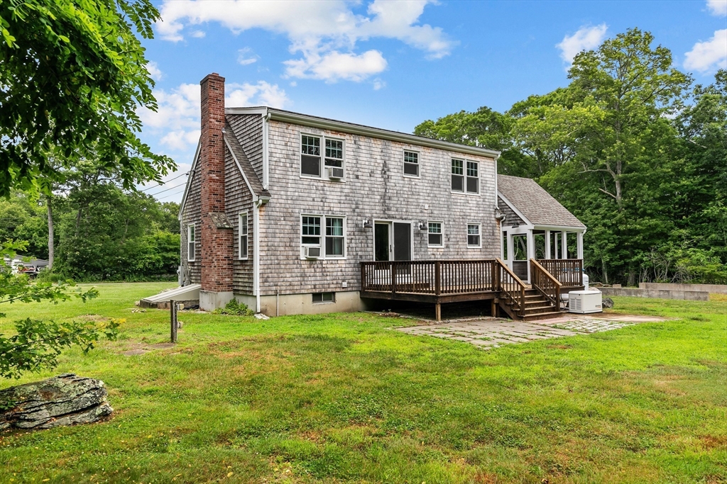 140 I Long Highway Little Compton, RI 02837 - Photo 32 of 41 a view of a house with a yard and sitting area