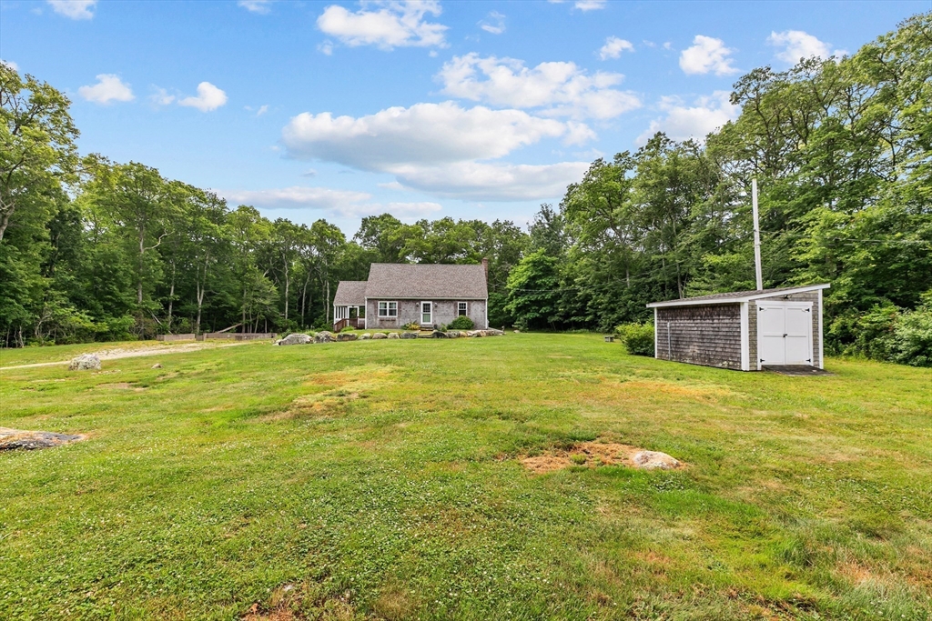 140 I Long Highway Little Compton, RI 02837 - Photo 35 of 41 a backyard of a house with lots of green space and mountain view in the background