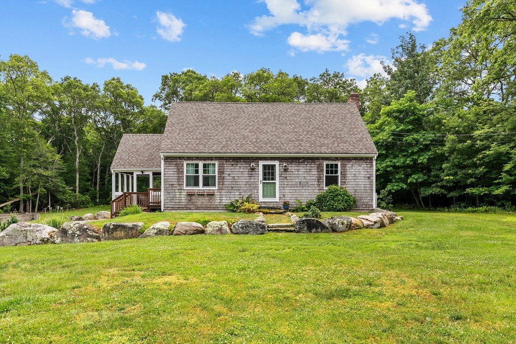140 I Long Highway Little Compton, RI 02837 - Photo 4 of 41 a view of a house with backyard sitting area and garden