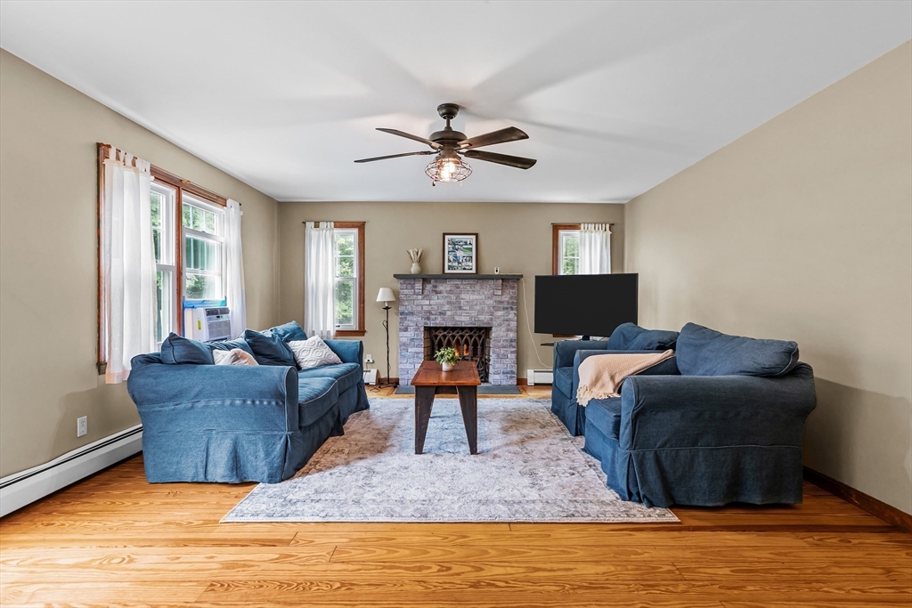 140 I Long Highway Little Compton, RI 02837 - Photo 7 of 41 a living room with furniture and a fireplace