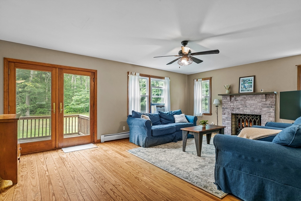 140 I Long Highway Little Compton, RI 02837 - Photo 8 of 41 a living room with furniture and a fireplace