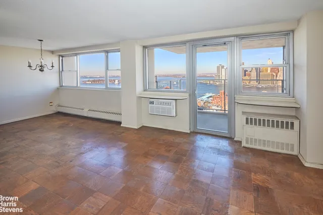 a view of an empty room with a window