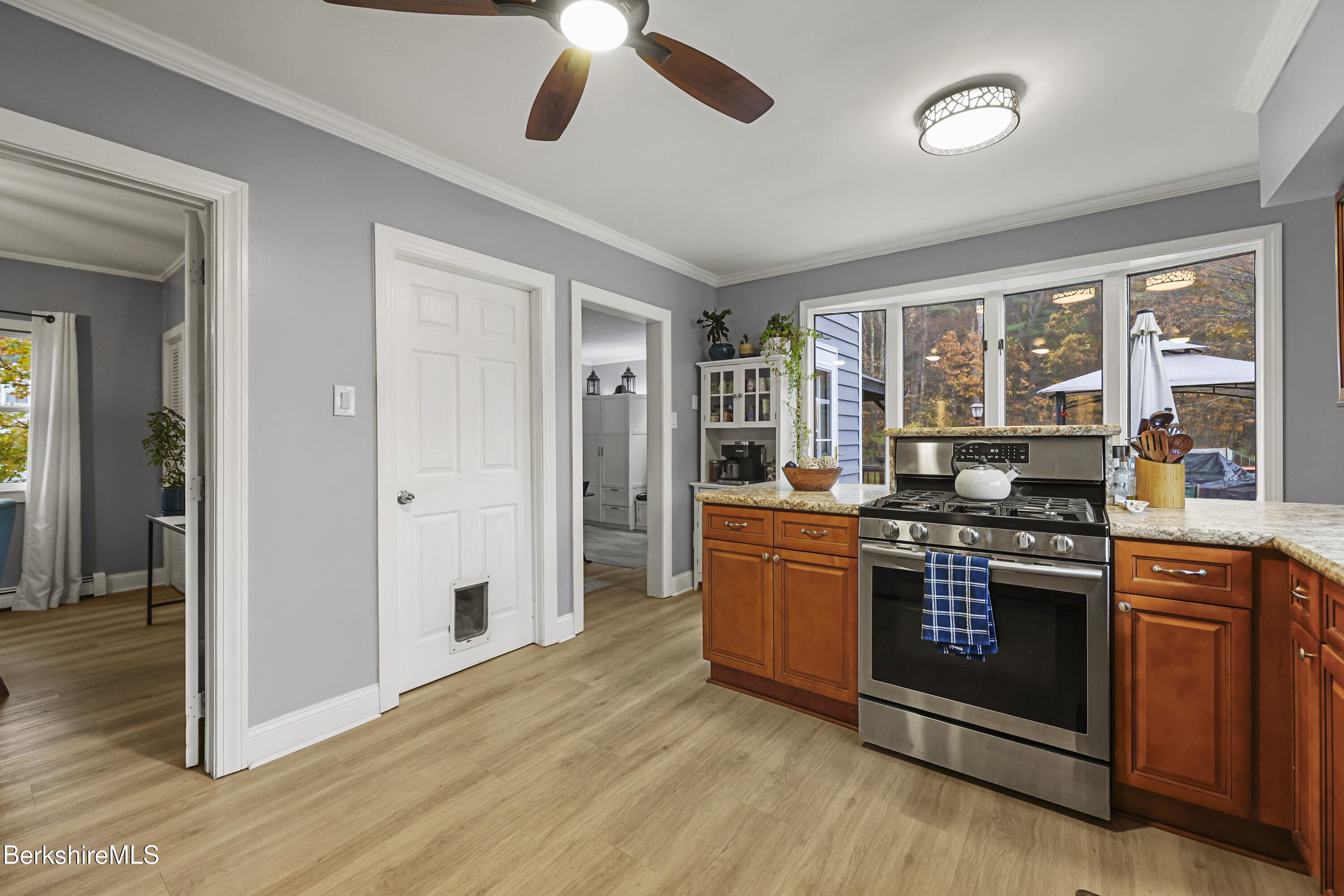 386 Cheshire Road Pittsfield, MA 01201 - Photo 13 of 45 a kitchen with stainless steel appliances granite countertop a stove and a refrigerator