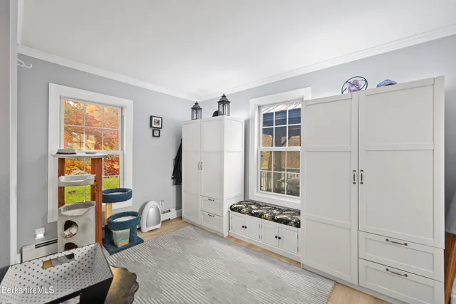 a room with furniture a rug and a window