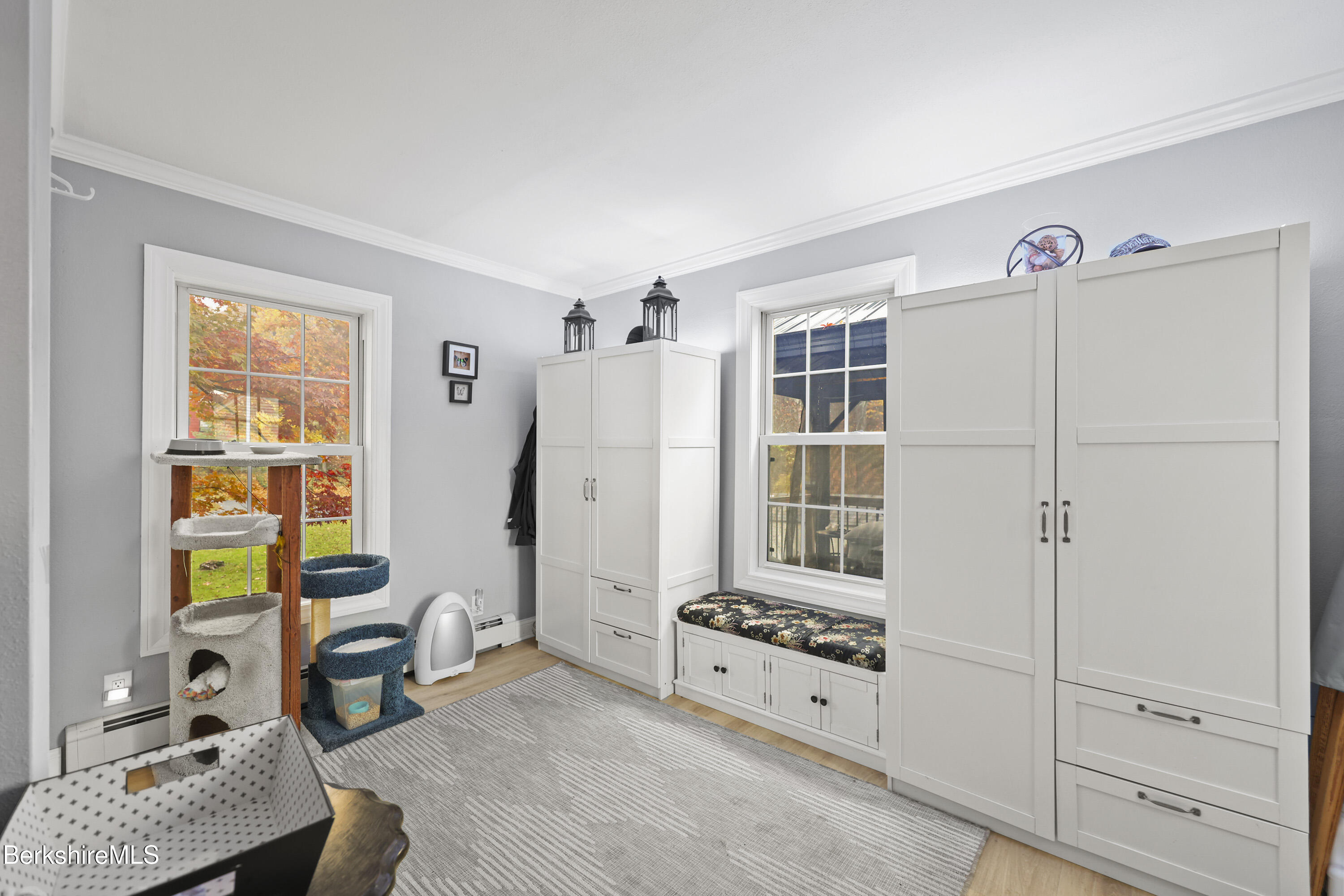 386 Cheshire Road Pittsfield, MA 01201 - Photo 17 of 45 a room with furniture a rug and a window