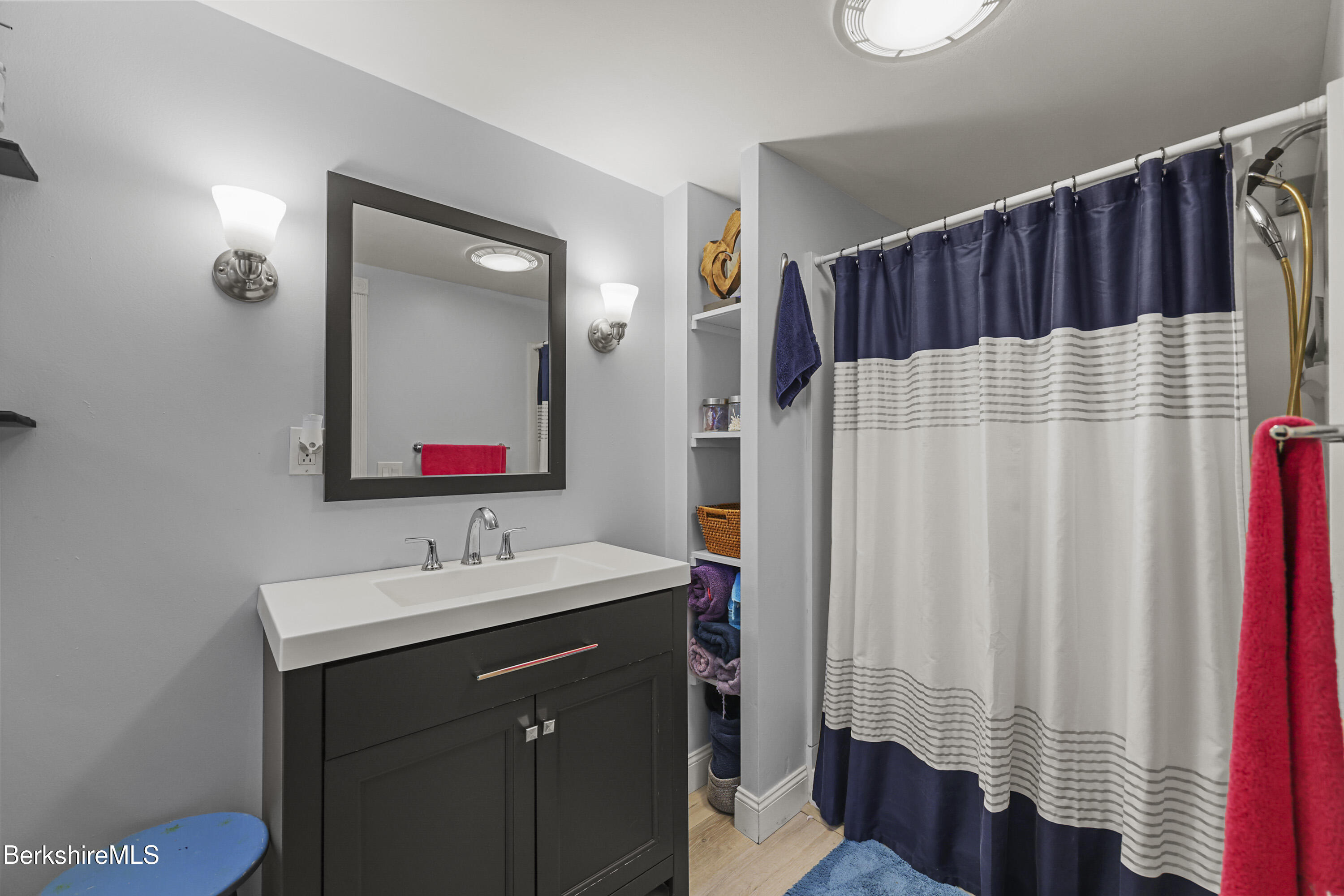386 Cheshire Road Pittsfield, MA 01201 - Photo 21 of 45 a bathroom with a sink and a mirror