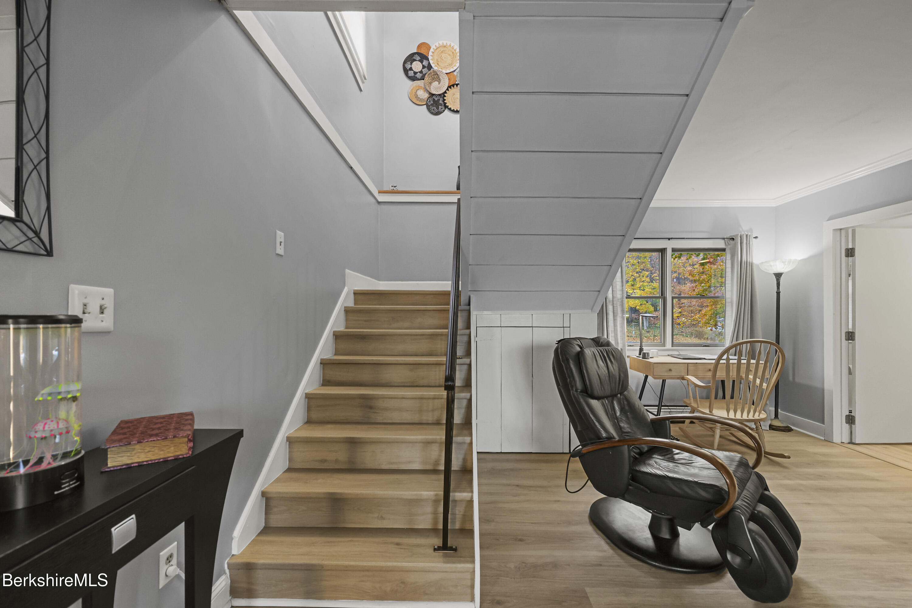 386 Cheshire Road Pittsfield, MA 01201 - Photo 22 of 45 a view of a livingroom with furniture and staircase