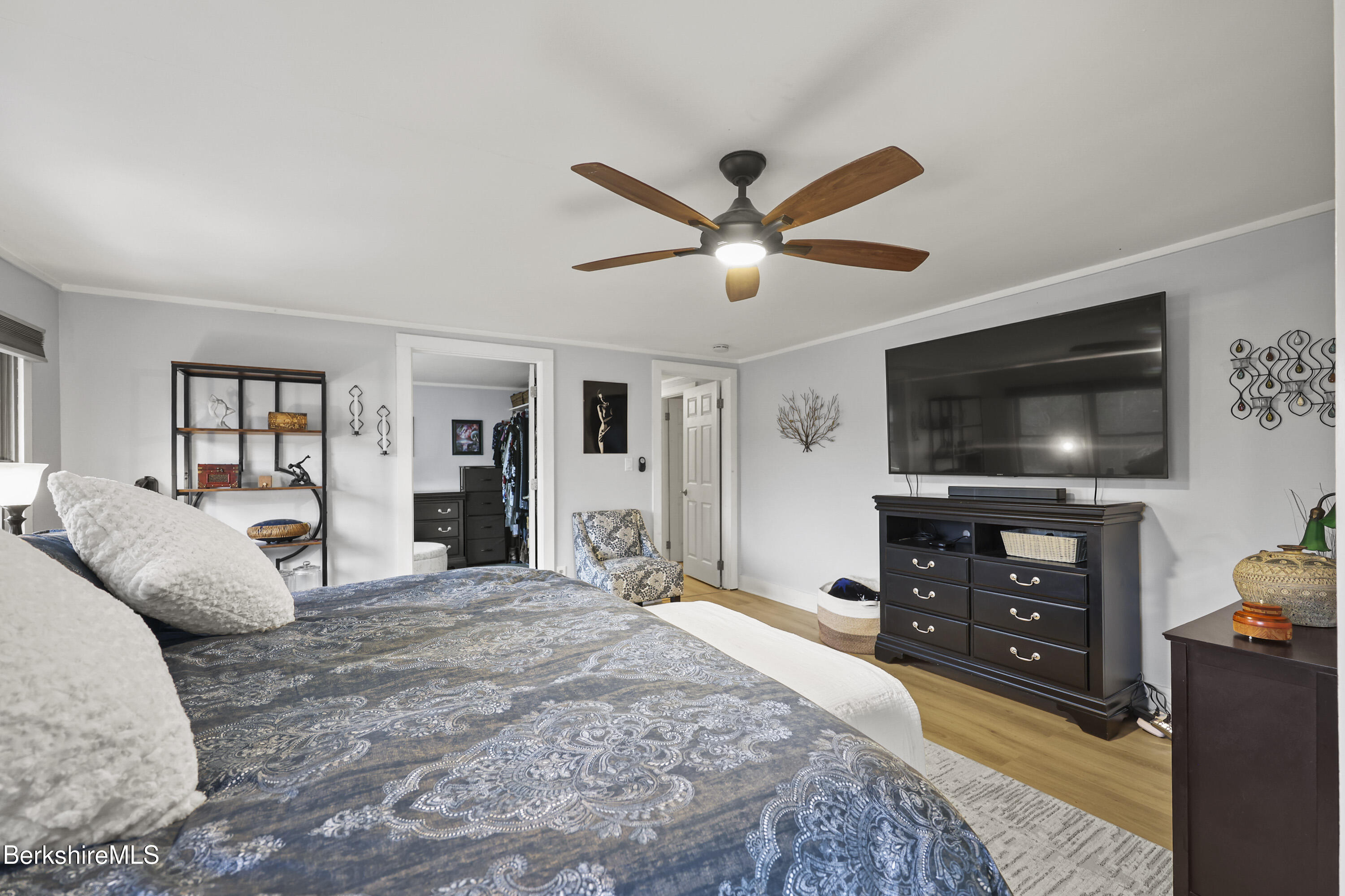 386 Cheshire Road Pittsfield, MA 01201 - Photo 26 of 45 a bedroom with a bed and a flat screen tv