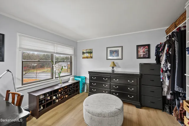 a bed room with a bed and a dresser