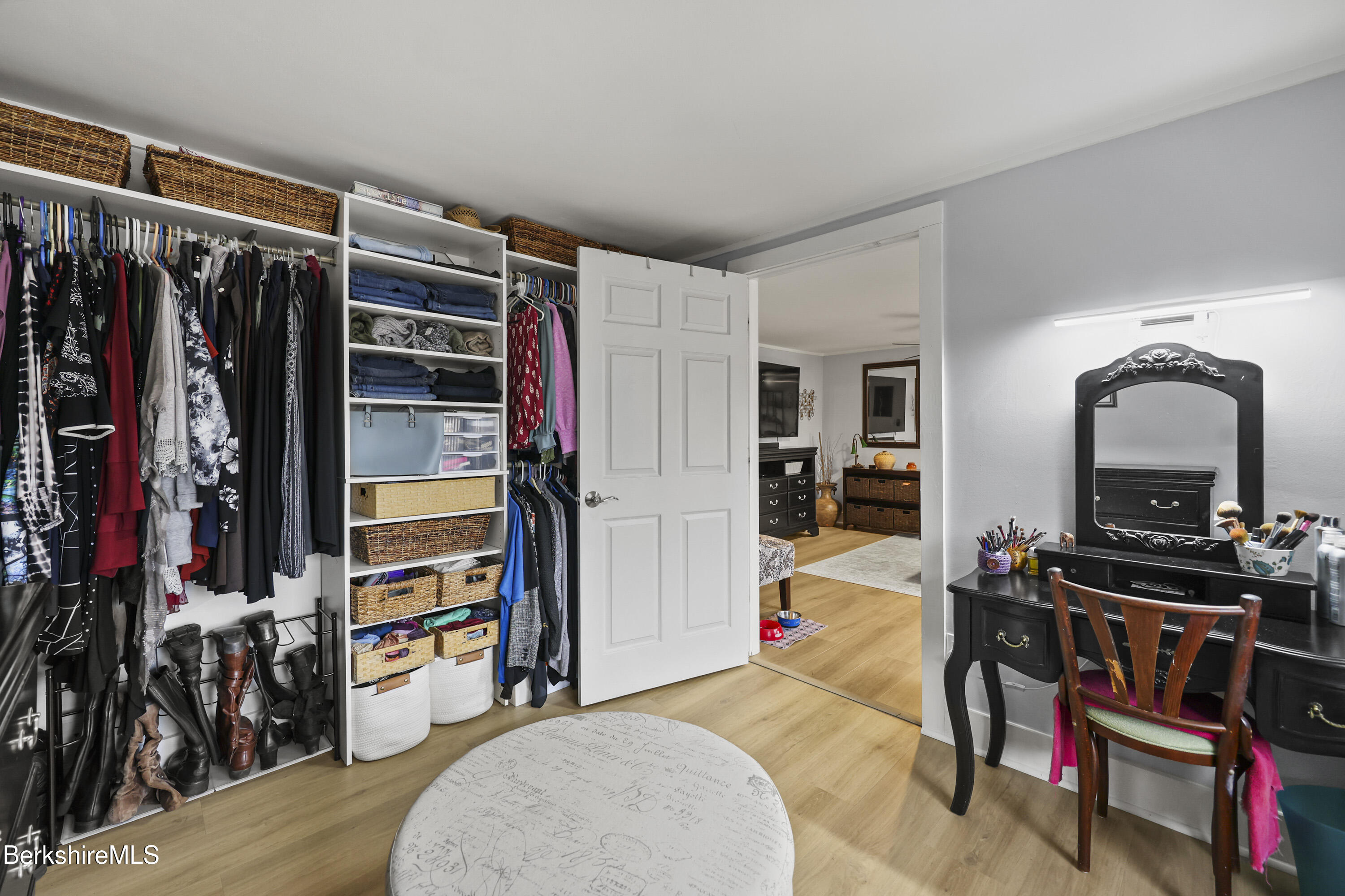 386 Cheshire Road Pittsfield, MA 01201 - Photo 28 of 45 a view of walk in closet with clothes and shoes