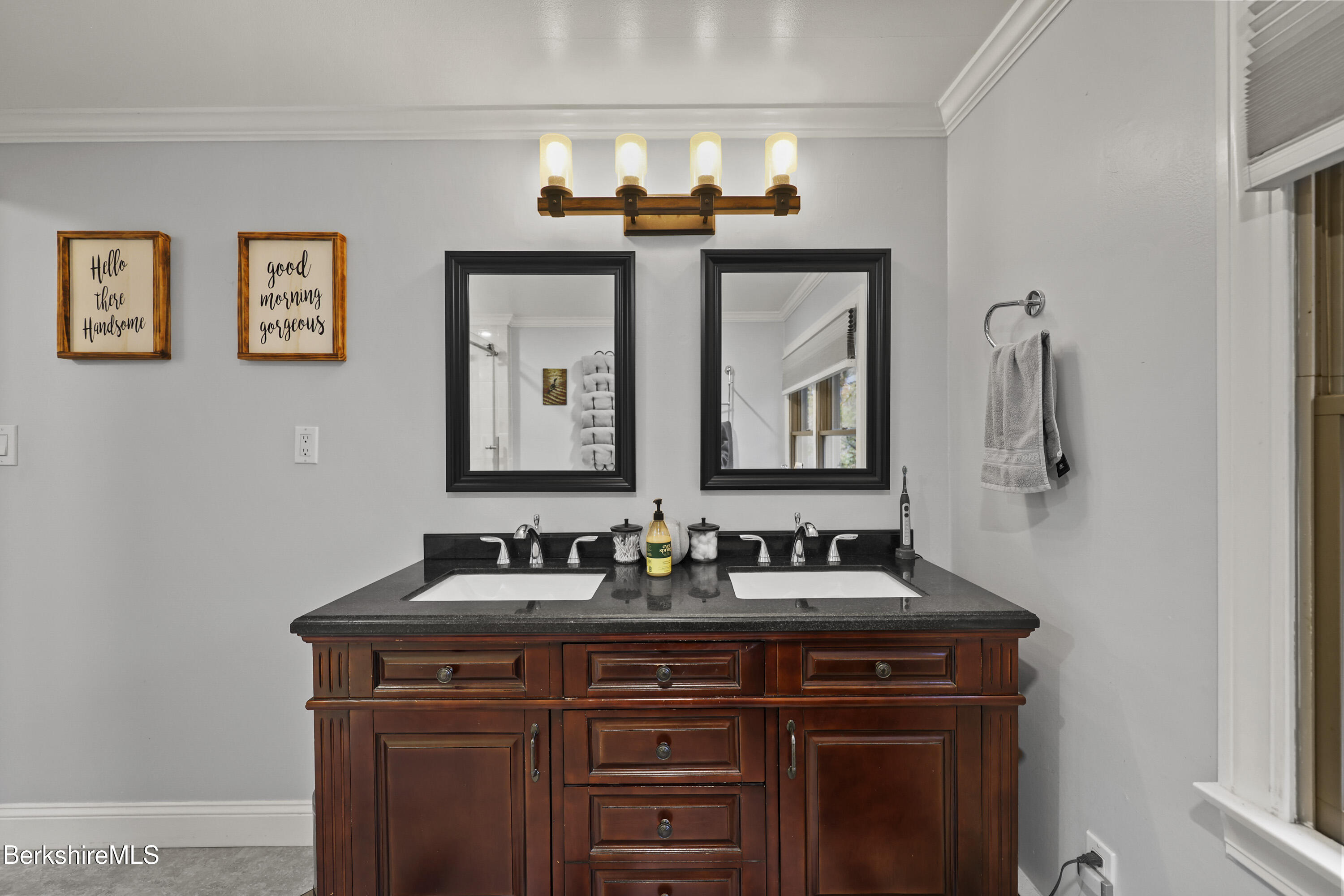 386 Cheshire Road Pittsfield, MA 01201 - Photo 37 of 45 a bathroom with a sink and a mirror