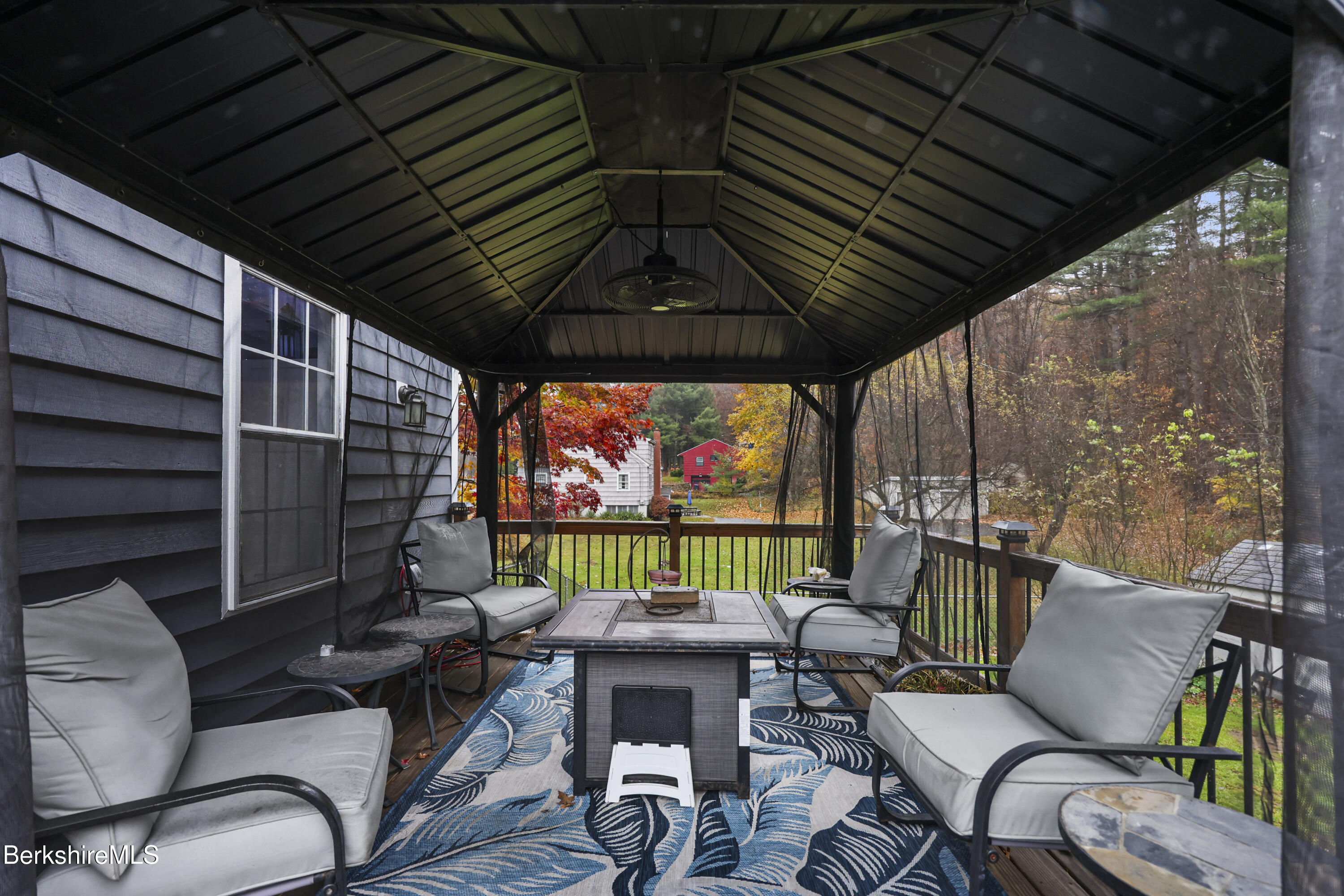 386 Cheshire Road Pittsfield, MA 01201 - Photo 39 of 45 a outdoor living space with patio furniture and a potted plant