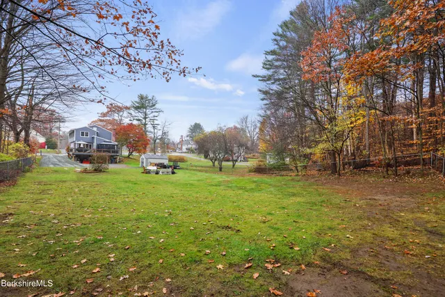 a view of outdoor space with garden and trees