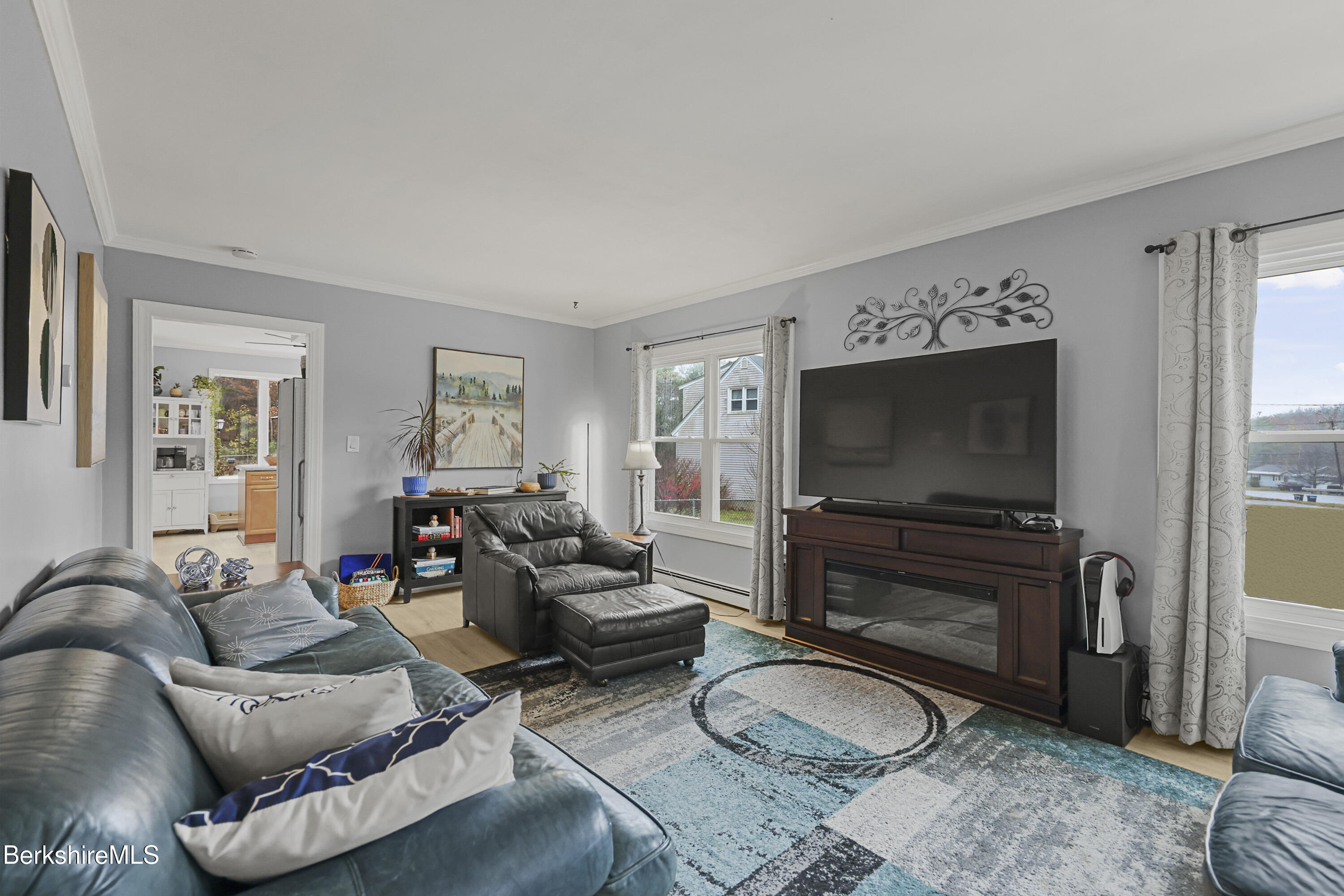 386 Cheshire Road Pittsfield, MA 01201 - Photo 5 of 45 a living room with furniture and a flat screen tv
