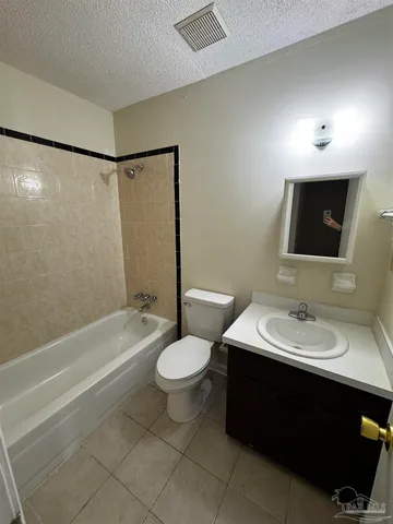 a bathroom with a sink toilet a mirror and shower