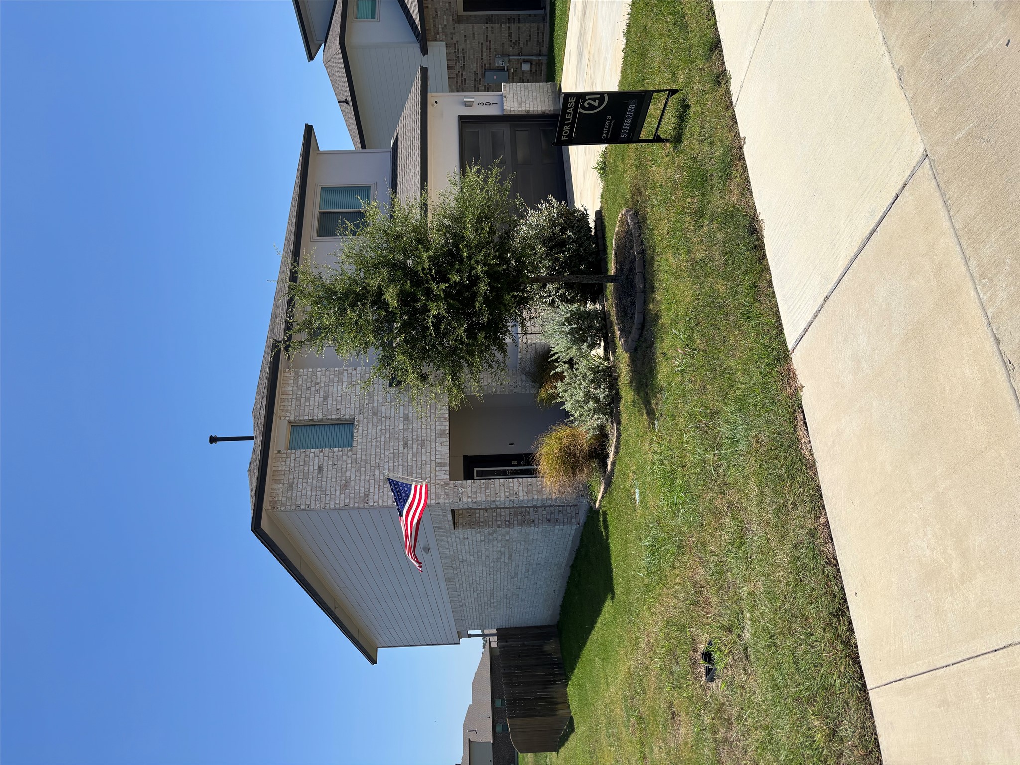 301 Tarkus Path Georgetown, TX 78633 - Photo 2 of 33 A contemporary two-story residence presents a tidy lawn, mature landscaping, and an inviting sidewalk approach.