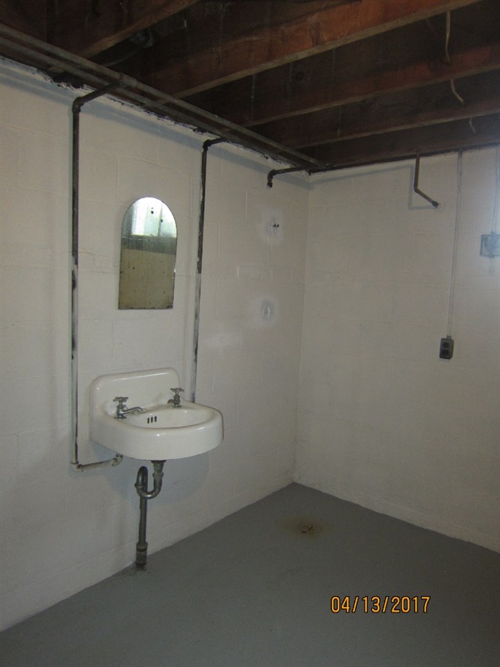 1917 Shutterlee Mill Road Staunton, VA 24401 - Photo 23 of 40 a bathroom with a sink a mirror and a shower