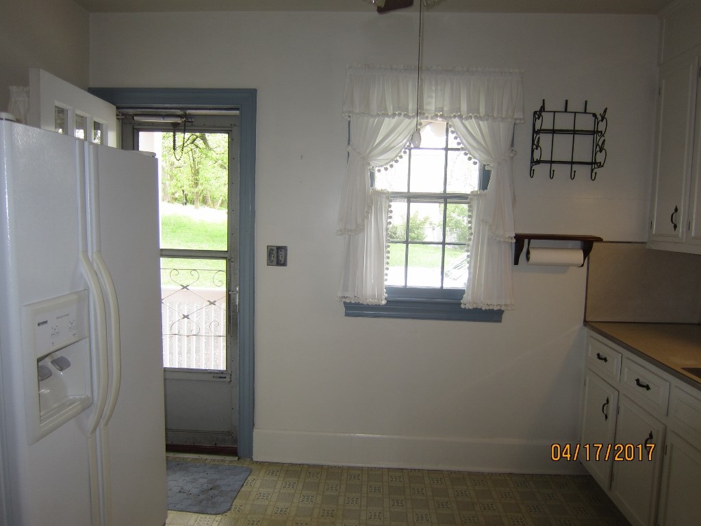 1917 Shutterlee Mill Road Staunton, VA 24401 - Photo 4 of 40 an empty room with windows and refrigerator