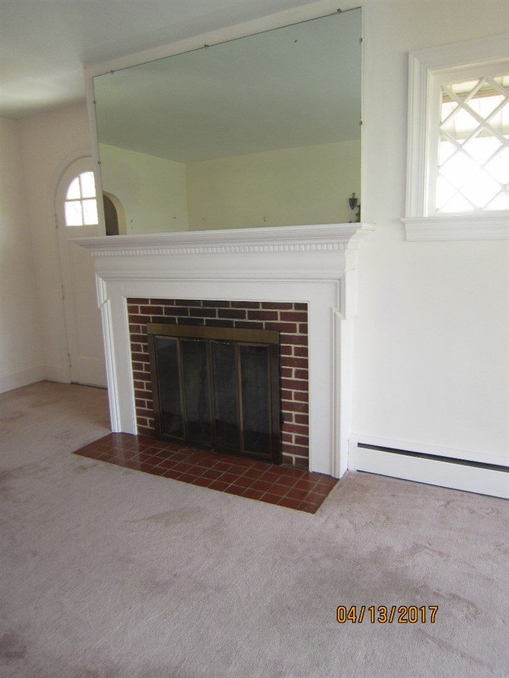 1917 Shutterlee Mill Road Staunton, VA 24401 - Photo 6 of 40 a living room with a fireplace