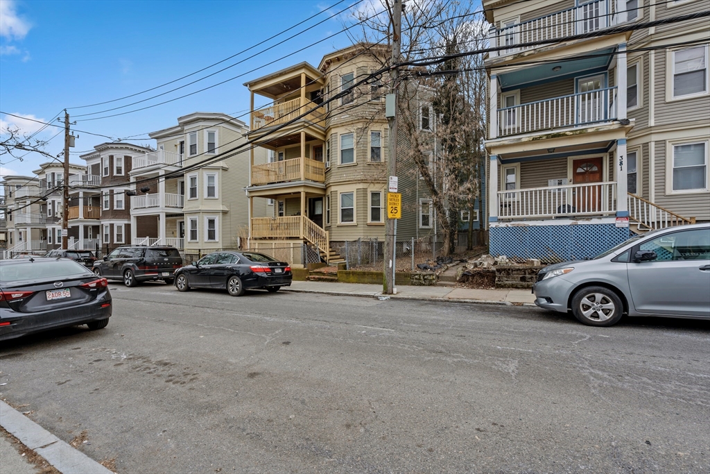 385 Centre Street, Unit 1 Boston, MA 02122 - Photo 13 of 14 a car parked in front of a building