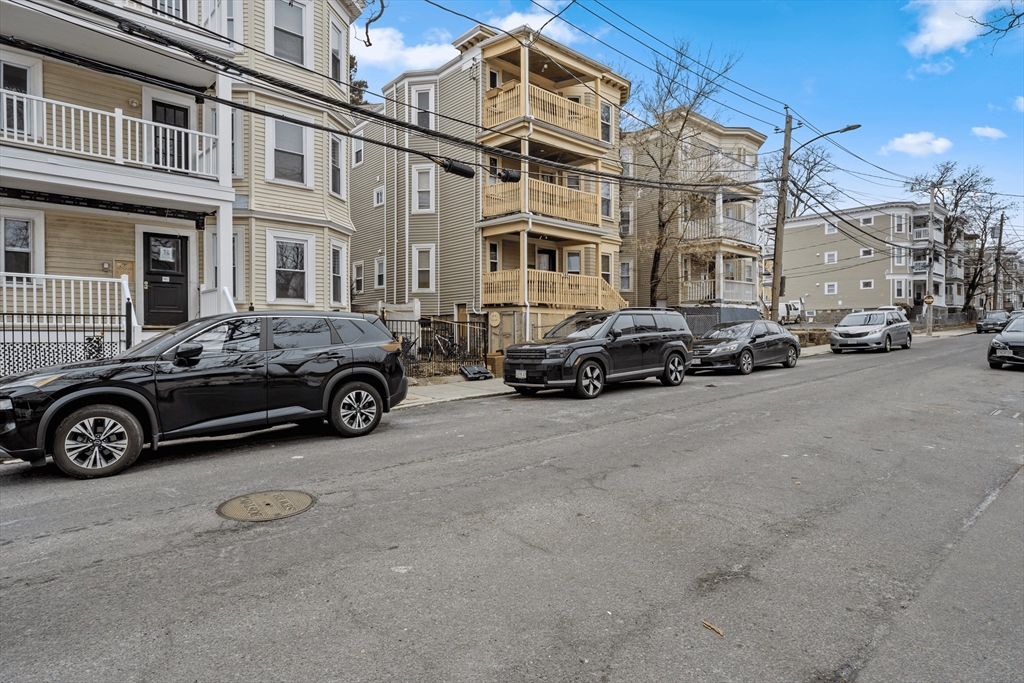 385 Centre Street, Unit 1 Boston, MA 02122 - Photo 14 of 14 a car parked in front of a building