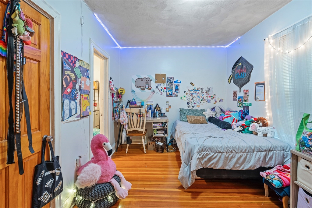 385 Centre Street, Unit 1 Boston, MA 02122 - Photo 8 of 14 a living room with furniture and baby couch