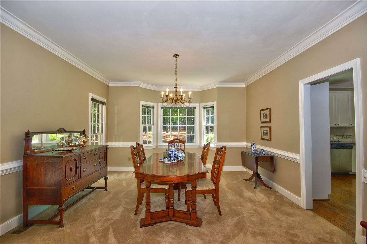 10520 New Arden Way Raleigh, NC 27613 - Photo 10 of 25 The formal dining room features a bay window, crown molding and chair rail. Large enough for a variety of furniture. Dining Room