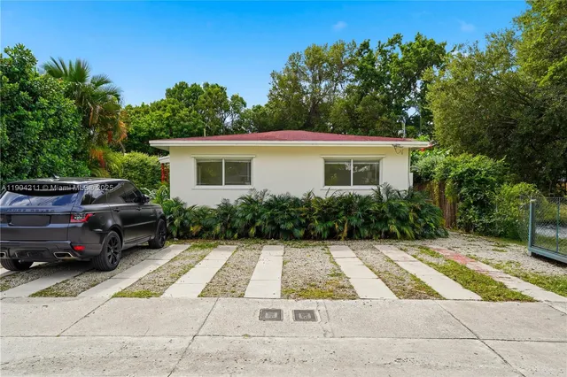 a view of backyard with seating space