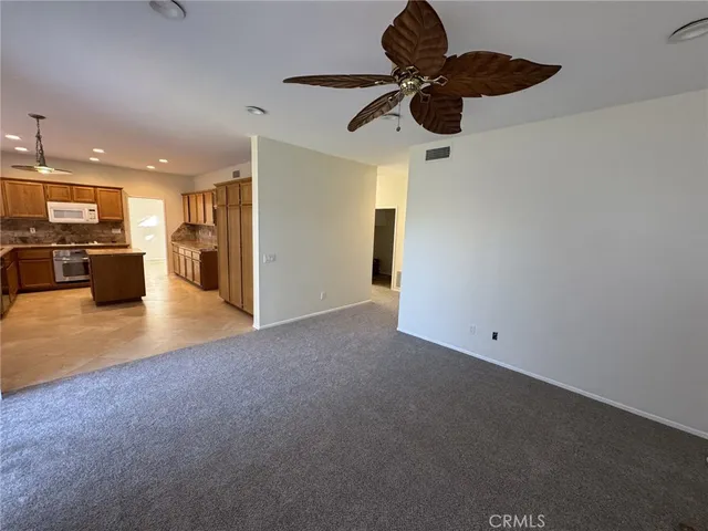 a view of a livingroom with kitchen