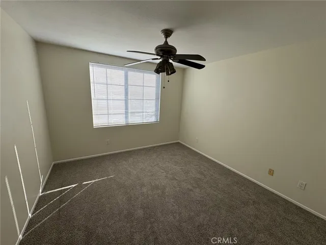 a view of a room with a hanging light