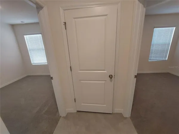 a bathroom with a granite countertop sink toilet mirror and shower