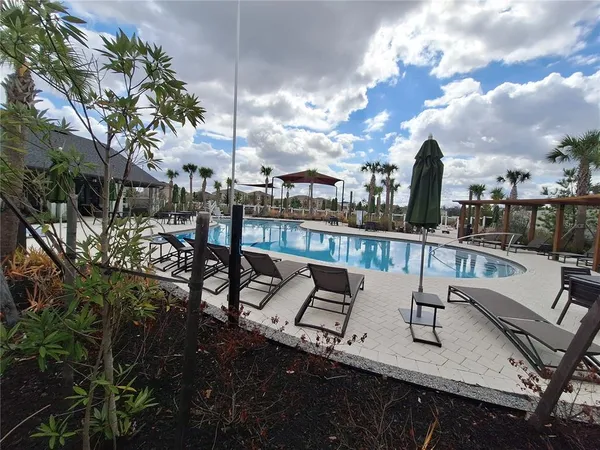 a view of a lake with sitting area