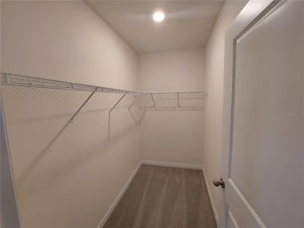 a view of a room with racks on the wall