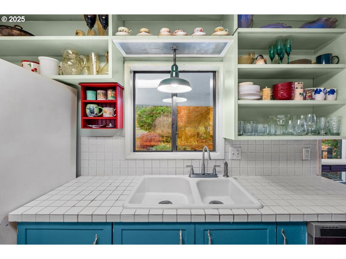 12602 Fry Road Northeast Aurora, OR 97002 - Photo 14 of 47 a bathroom with a sink and a window
