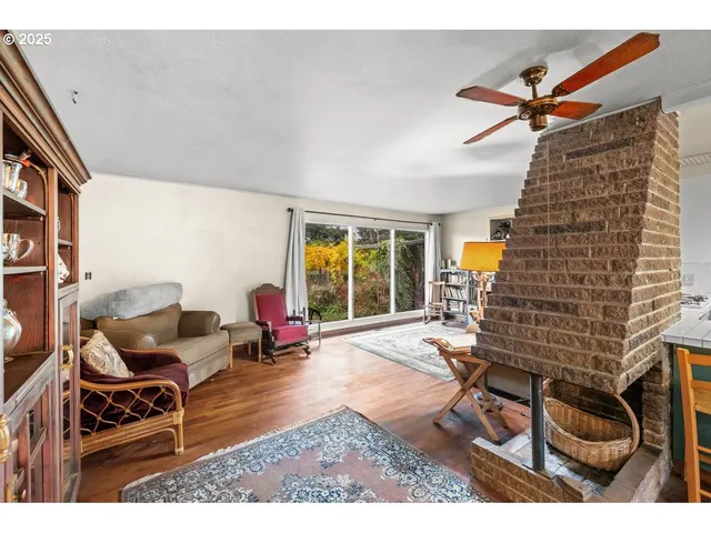 a living room with furniture and large window