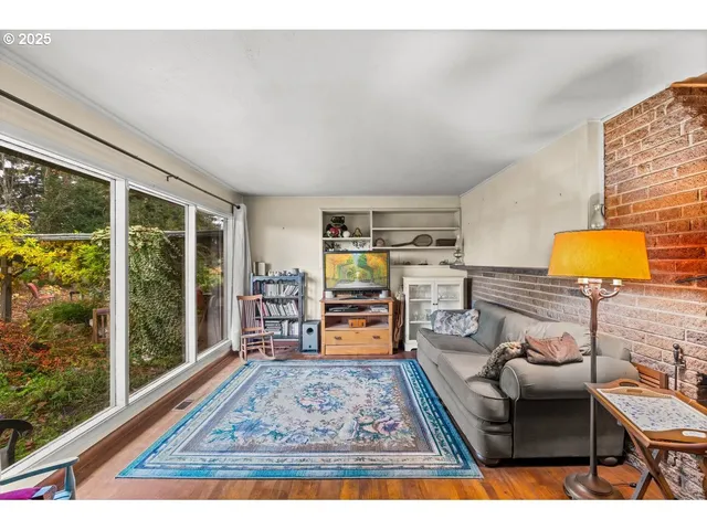 a view of living room with furniture and rug