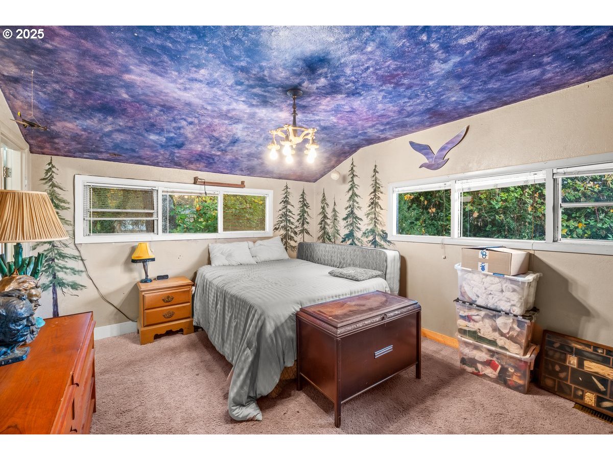 12602 Fry Road Northeast Aurora, OR 97002 - Photo 24 of 47 a bedroom with furniture and a large window
