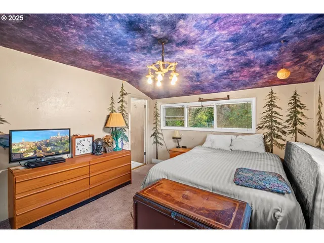 a bedroom with furniture and wooden floor