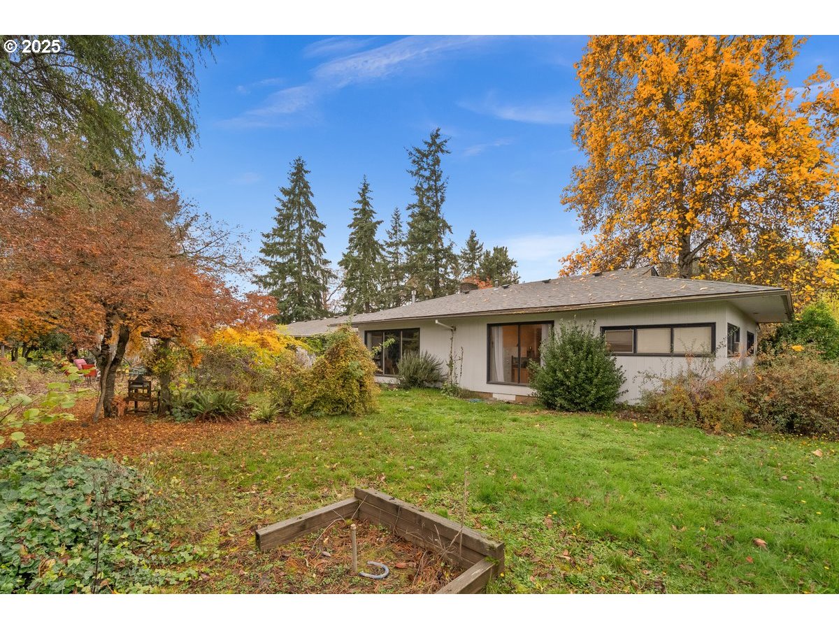 12602 Fry Road Northeast Aurora, OR 97002 - Photo 32 of 47 a view of a backyard with large trees