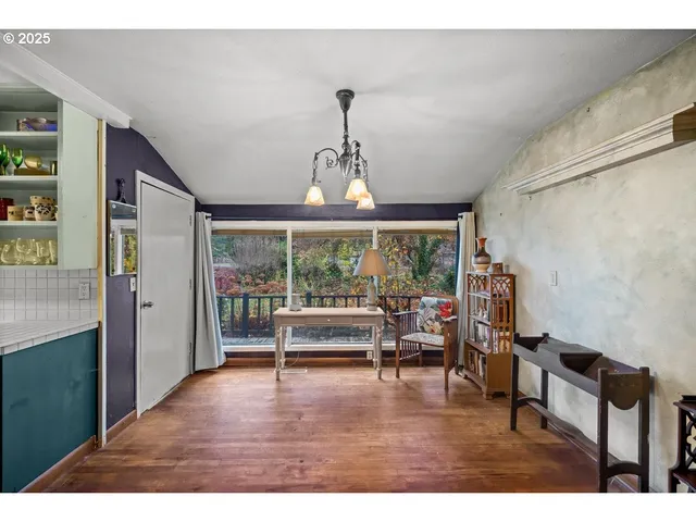 a bedroom with furniture and a window