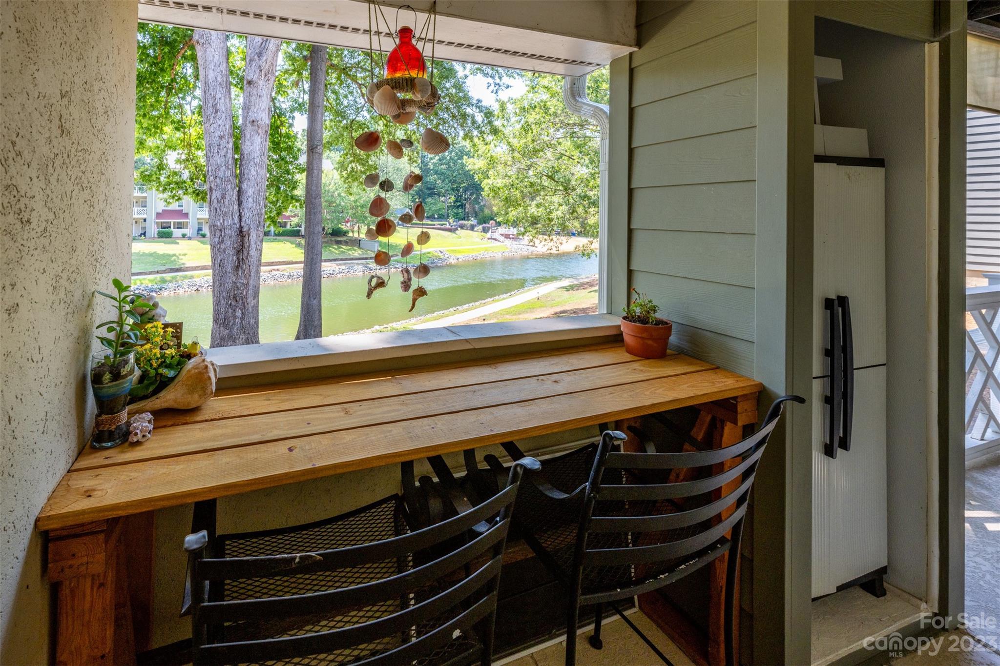20101 Henderson Road, Unit H Cornelius, NC 28031 - Photo 22 of 48 a view of a room with wooden floor and windows