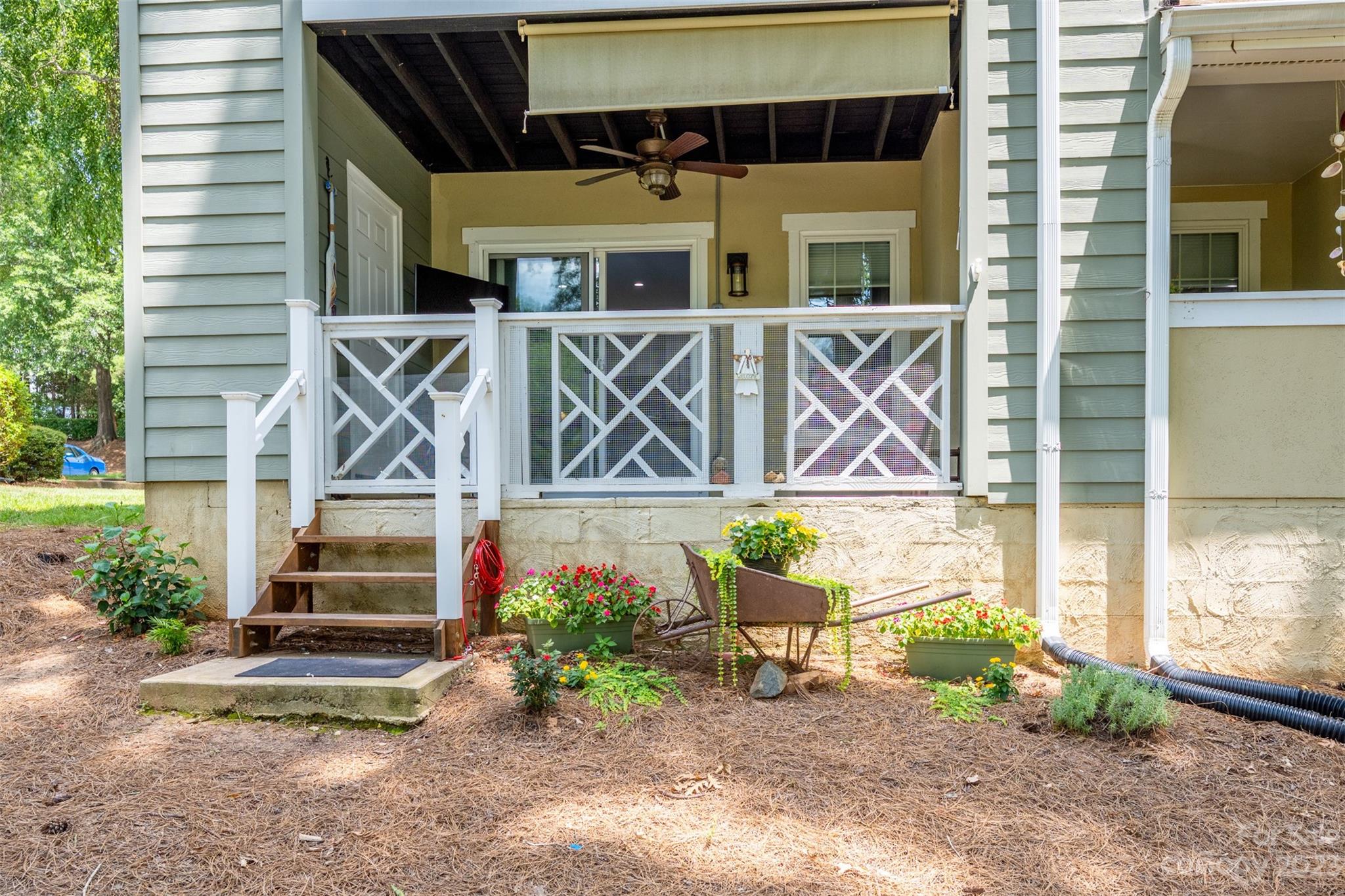 20101 Henderson Road, Unit H Cornelius, NC 28031 - Photo 27 of 48 a front view of a house with a yard