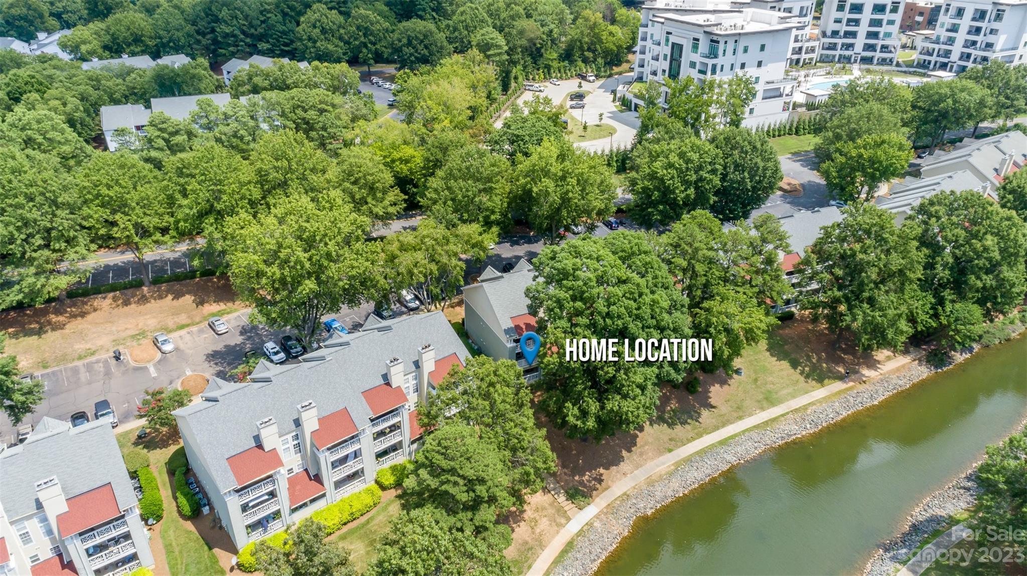 20101 Henderson Road, Unit H Cornelius, NC 28031 - Photo 31 of 48 an aerial view of a house with a yard and lake view