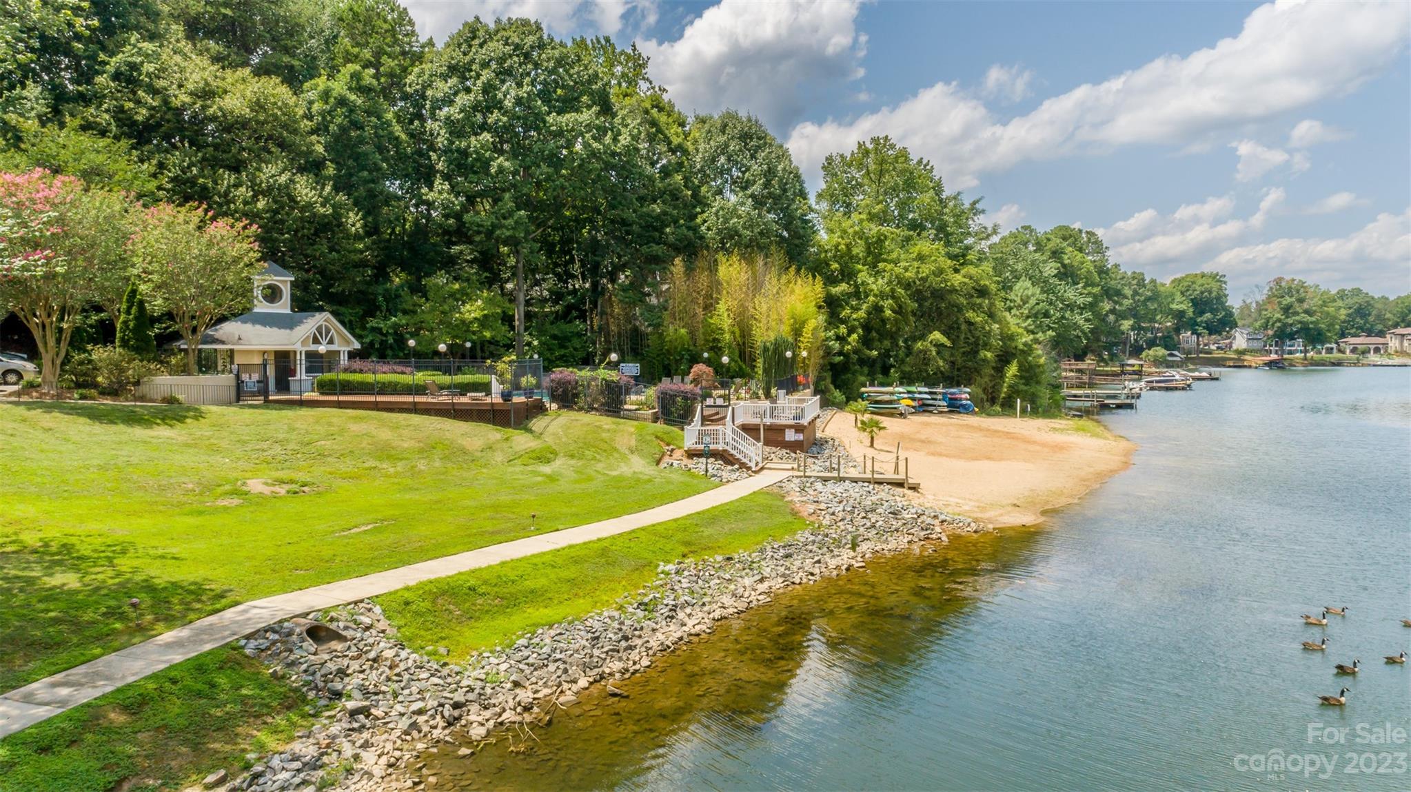 20101 Henderson Road, Unit H Cornelius, NC 28031 - Photo 38 of 48 a view of a swimming pool with an outdoor space and seating area