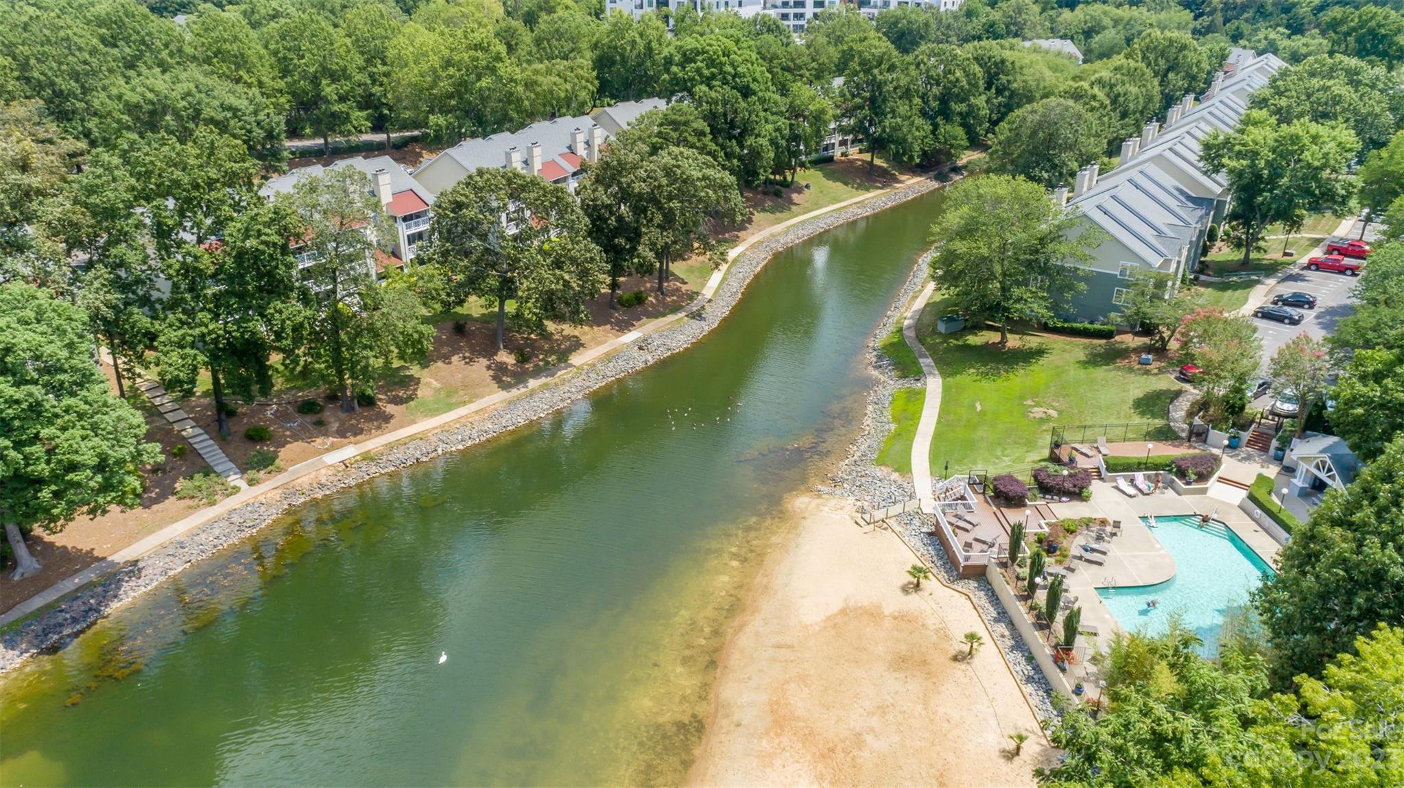 20101 Henderson Road, Unit H Cornelius, NC 28031 - Photo 39 of 48 an aerial view of a house with a yard and lake view