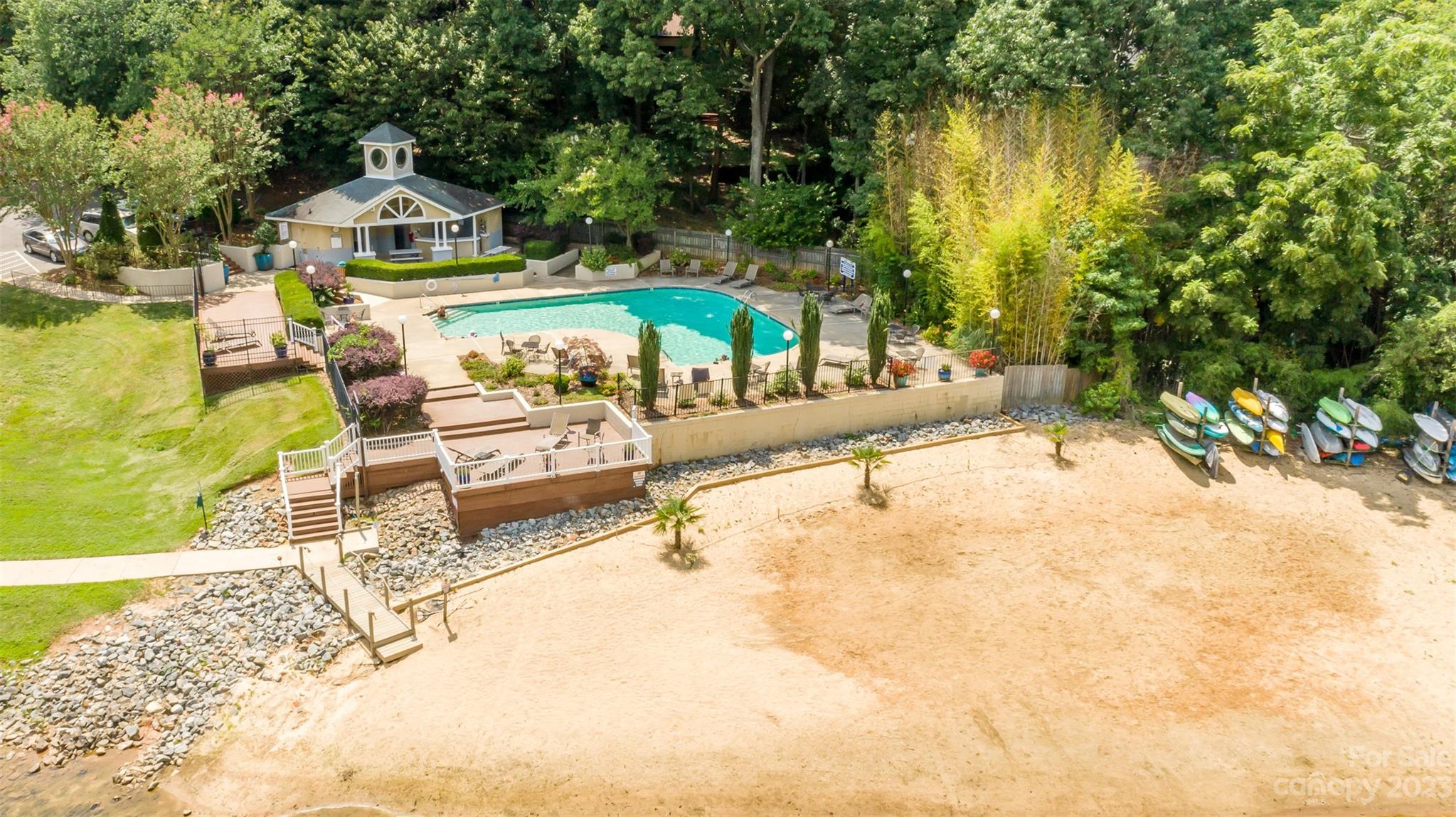 20101 Henderson Road, Unit H Cornelius, NC 28031 - Photo 41 of 48 a swimming pool with outdoor seating and yard